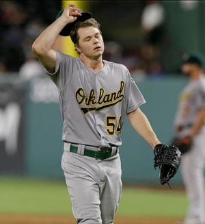 Oakland Athletics starting pitcher Sonny Gray reacts to giving up a home run to Texas Rangers' Joey Gallo during the fifth inning of a baseball game in Arlington, Texas, Tuesday, July 26, 2016. (AP Photo/LM Otero)