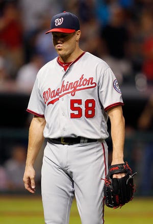 Washington Nationals relief pitcher Jonathan Papelbon walks off after being pulled after loading the bases with Cleveland Indians during the ninth inning of a baseball game Tuesday, July 26, 2016, in Cleveland. The Indians won 7-6. (AP Photo/Ron Schwane)