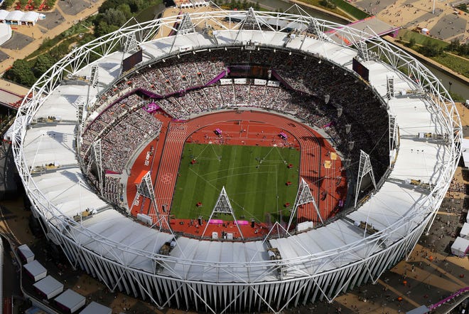 FILE - This is a Friday, Aug. 3, 2012 file photo of an aerial photo of the Olympic Stadium during the 2012 Summer Olympics at Olympic Park , in London. The IOC said Friday July 22, 2016, that 45 more athletes â€” including 23 medalists â€” have been caught for doping in retesting of samples from the 2008 and 2012 Olympics. The new cases bring to 98 the number of athletes who have failed tests so far in the reanalysis of their stored samples form the Beijing and London Games. (AP Photo/Jeff J Mitchell, Pool, File)