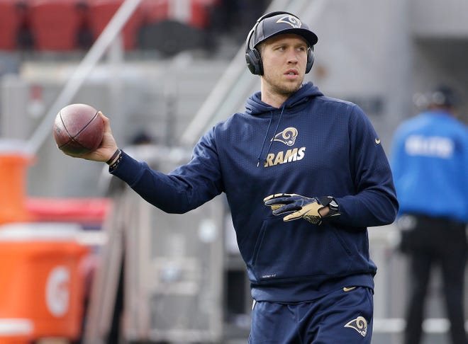 St. Louis Rams quarterback Nick Foles warms up before an NFL football game against the San Francisco 49ers in Santa Clara, Calif., Sunday, Jan. 3, 2016. The Los Angeles Rams have released Foles after failing to find a trade destination for the disgruntled quarterback. The Rams announced the move Wednesday, July 27, 2016, one day before their veterans report to training camp.(AP Photo/Marcio Jose Sanchez)