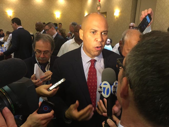 U.S. Sen. Cory Booker speaks to reporters on the final day of the Democratic National Convention in Philadelphia.