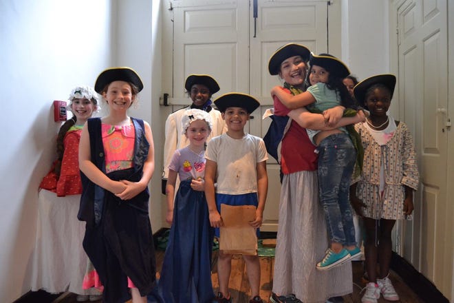 Children dressed up in Colonial clothing at the Trent House Museum.