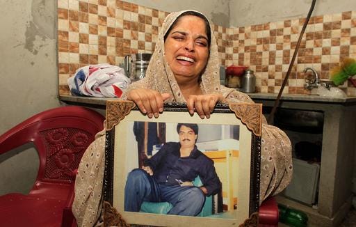 Humaira Bibi, sister of Zulfikar Ali, convicted of drug crimes, cries in Lahore, Pakistan, Wednesday, July 27, 2016. The sister of a Pakistani convicted of drug crimes has appealed the Indonesian government to spare the life of her ailing brother who is expected to be executed by a firing squad along with 12 others in the next 48 hours. (AP Photo/K.M. Chaudary)