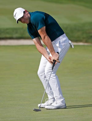 Rory McIlroy reacts to missing a putt on the 14th hole during the first round of the PGA Championship golf tournament at Baltusrol Golf Club in Springfield, N.J., Thursday, July 28, 2016. (AP Photo/Mike Groll)