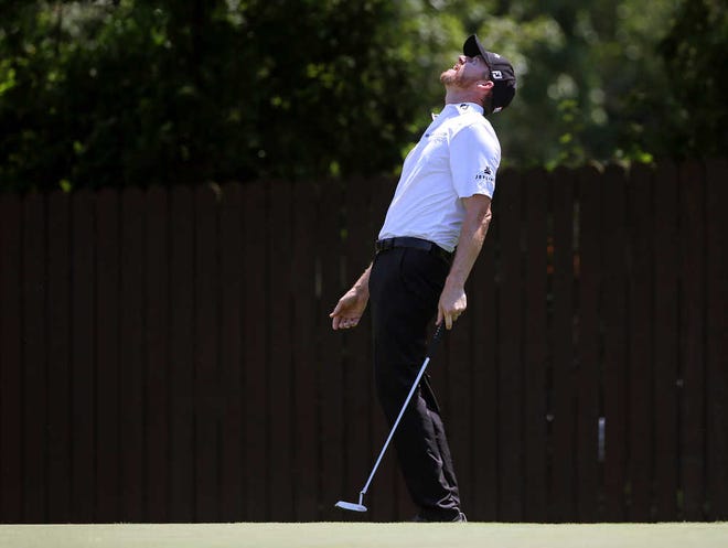Seth Wenig/Associated Press Jimmy Walker reacts to his putt on the seventh hole during the first round. Walker, who has finished within five shots of a winner only once this season, leads by one shot over three players after Day 1.