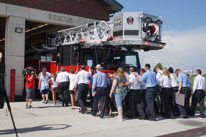 The ceremonial push back at Clermont Fire Station 3. The "3" logo on the platform at the end of the ladder states "Legends Live Forever," a nod to the station's location on Legends Way, across from the National Training Center athletic fields. The 2016 Pierce Velocity, a 100-foot aerial tower truck, is dedicated to the memory of Assistant Chief April Hoover.