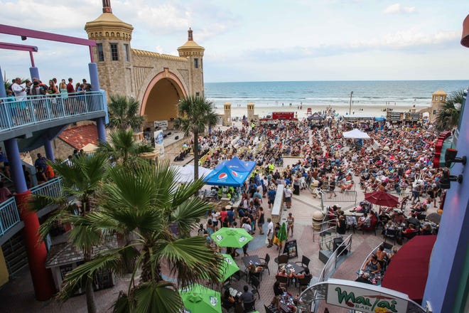 People ready to watch the free concert at the Bandsheel at the Ocean Walk in Daytona Beach on Saturday, July 9, 2016. News-Journal / LOLA GOMEZ