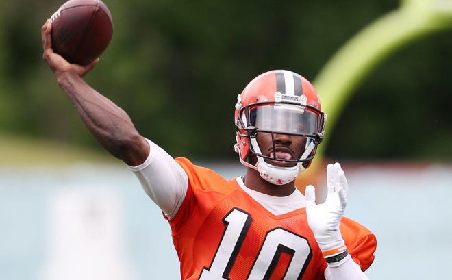 This June 7, 2016, file photo shows Cleveland Browns quarterback Robert Griffin III throwing during NFL football mini camp at the practice facility in Berea, Ohio. Cleveland Browns coach Hue Jackson said he will name his starting quarterback for this season before the team's first exhibition game next month. The Browns will open the preseason on Aug. 12 at Green Bay and Jackson said he will have his starter in place by then. Griffin is expected to win the starting job over veteran Josh McCown and rookie Cody Kessler. (AP Photo/Ron Schwane, File)