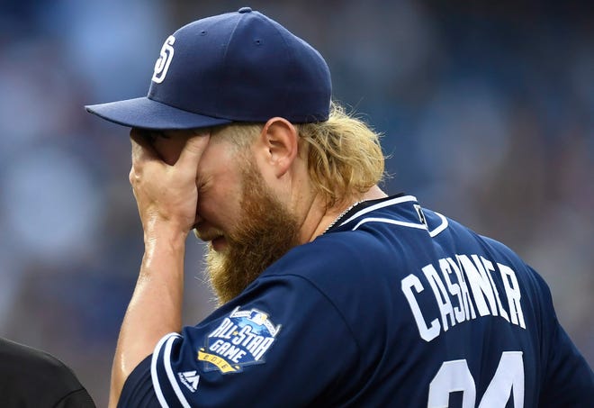 San Diego Padres starting pitcher Andrew Cashner reacts on the mound during the first inning of the team's baseball game against the Toronto Blue Jays on Tuesday, July 26, 2016, in Toronto. (Frank Gunn/The Canadian Press via AP)