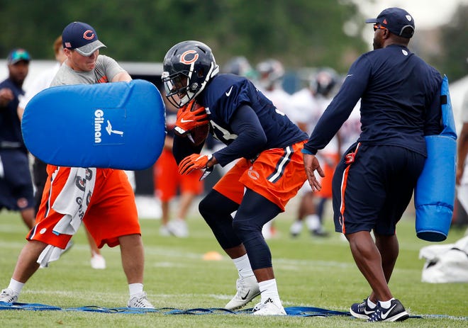 Chicago Bears running back Jeremy Langford works on the field during practice at the NFL football teams training camp at Olivet Nazarene University, in Bourbonnais, Ill., Friday, July 29, 2016. (AP Photo/Nam Y. Huh)