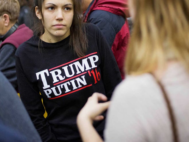 A woman wears a shirt reading "Trump Putin '16" while waiting for Donald Trump to speak at a campaign event at Plymouth State University in Plymouth, New Hampshire, on Feb. 7.