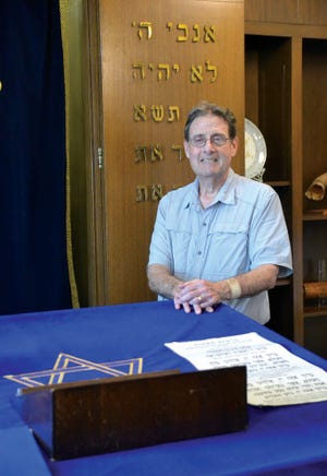 Rabbi Alan Alpert stands in the chapel at Congregation Agudat Achim. “When it gets really crazy, I escape and go in there and meditate,” he said. “I learned vocal breathing and centering from a priest many years ago. I did a unit of clinical pastoral education at Brigham and Women’s Hospital, and that was one the best classes I ever took.”