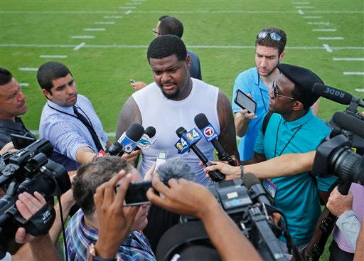 Miami Dolphins' Jordan Phillips (97) talks to the media after the NFL football teams training camp in Davie, Fla., Friday, July 29, 2016. (AP Photo/Joel Auerbach)