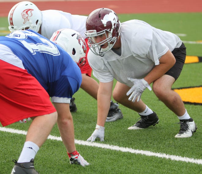 A mainstay on the Salina Central offensive line where he was a three-time all-Ark Valley Chisholm Trail League first-team pick, Cort Enriquez (maroon helmet) will play guard for the last time tonight when the West squad battles in the annual Shrine Bowl. The 6-foot, 225-pound Enriquez is expected to play fullback or tight end at Dodge City Community College.