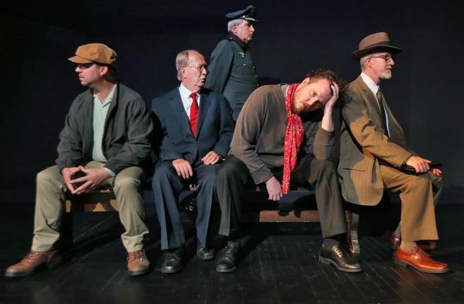 Brian Hinton (back) walks past Will Therrien (left), Mike Stone (middle left) Jason Betz (middle right) and J. Scott Taylor (right). 'Incident at Vichy' will hit the stage at 7:30 p.m. Thursday.