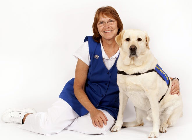 Barbara Bray and her Labrador retriever D'Jango, were named Halifax Health Volunteer of the Month for June.