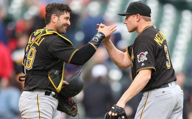 Pittsburgh Pirates' Francisco Cervelli congratulates Mark Melancon after a win over the Detroit Tigers on Monday, April 11, 2016, at Comerica Park in Detroit. Melancon was traded to the Washington Nationals for reliever Felipe Rivero and pitching prospect Taylor Hearn on Saturday, July 30. (Detroit Free Press/TNS)