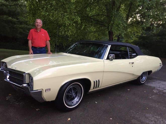 Brian Borger, the Small Business Collaborative's first director, is an antique car aficionado. Here, he poses near his 1969 Buick Skylark convertible. SUSAN VELA/STAFF PHOTOGRAPHER/THE JOURNAL-STANDARD