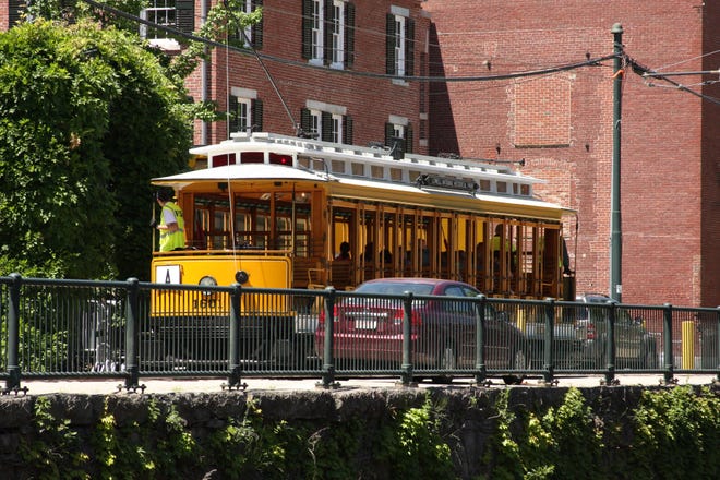 Yellow trolleys will take you along Lowell's canals.



Photo/Michael Hartigan