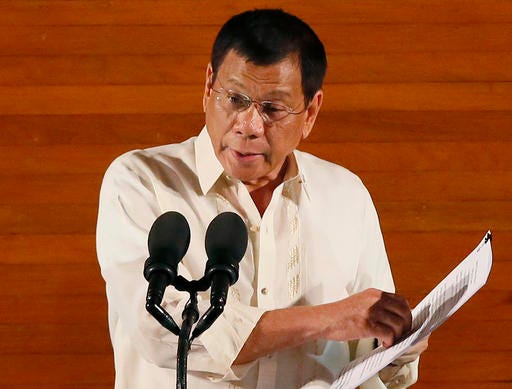 FILE - In this Monday, July 25, 2016 file photo, Philippine President Rodrigo Duterte delivers his first State of the Nation Address before the joint session of the 17th Congress in suburban Quezon city, northeast of Manila, Philippines. Duterte on Thursday, July 28, threatened to withdraw a ceasefire order he gave three days ago after suspected communist rebels killed a government militiaman and wounded four others in an attack. (AP Photo/Bullit Marquez, File)