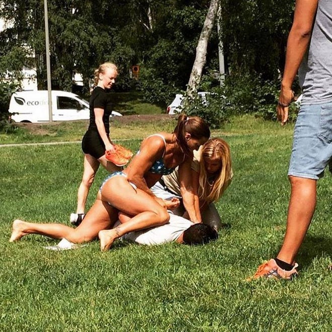 Swedish police officer Mikaela Kellner pins a man to the ground who is suspected to have stolen a friend's mobile phone in Stockholm, Sweden, on July 27. She was off duty and wearing a bikini but that didn't stop her from apprehending the man.