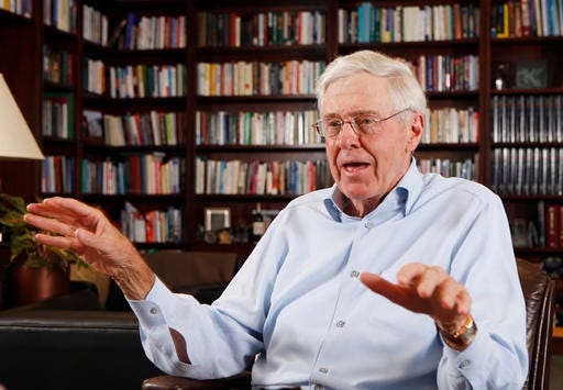 FILE - In this photo May 22, 2012 file photo, Charles Koch speaks in his office at Koch Industries in Wichita, Kansas. Billionaire industrialist and conservative benefactor Koch is hosting hundreds of the nation's most powerful political donors this weekend in Colorado. The exclusive gathering at the foot of the Rocky Mountains is open to donors who promise to give at least $100,000 each year to Koch-approved groups. The Koch network has avoided supporting Donald Trump's presidential campaign so far. (Bo Rader/The Wichita Eagle via AP, File)