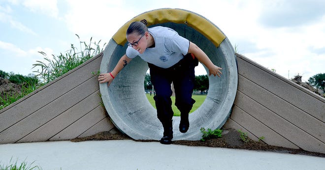 Brianna Price walks through a culvert while running through an obstacle course at the Lake Tech Institute of Public Safety's police academy class on Wednesday in Tavares. (Amber Riccinto/ Daily Commercial)