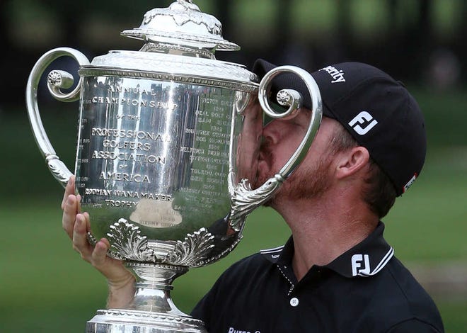 Jimmy Walker kisses the trophy after winning the PGA Championship on Sunday.