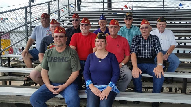 Logan County Veteran’s were honored with a ceremony before the harness races Sunday at the Logan County Fair grandstand. Pictured above, in the first row, are Jack Bishop and Michelle Ramlow. In the second row Bill Stauffer, Michael Downen, Bill Dennis, and Gene Hickey are seen. Dick Halcomb, Jim Harnacke, Joe Schaler, Ray Shelton and Vince long are in the back row. Photo by Jean Ann Miller/The Courier.