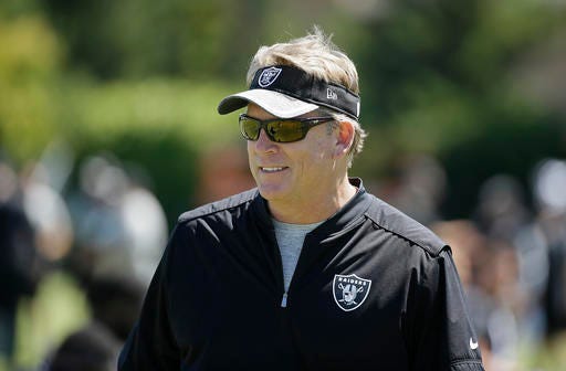 Oakland Raiders head coach Jack Del Rio watches players stretch during practice at the NFL football team's training camp Saturday, July 30, 2016, in Napa, Calif. (AP Photo/Eric Risberg)
