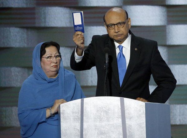Khizr Khan holds a copy of the Constitution of the United States, which he offered to lend to Donald Trump, with his wife Ghazala Khan, during the last day of the Democratic National Convention at the Wells Fargo Center in Philadelphia on July 28.