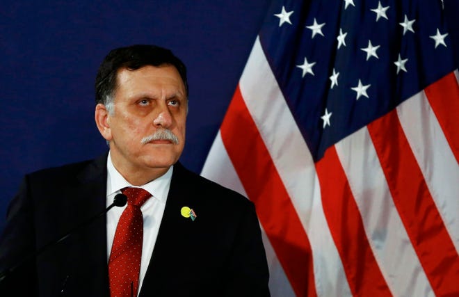FILE - In this May 16, 2106 file-pool photo, Fayez al-Sarraj, the head of the U.N.-brokered presidency council, attends a news conference in Vienna, Austria. The U.S. launched multiple airstrikes against Islamic State militants Monday, Aug. 1, 2016, opening a new, more persistent front against the group at the request of the UN-backed Libyan government, Libyan and U.S. officials said. Serraj, said in a televised statement that American warplanes attacked the IS bastion of Sirte. No U.S. ground forces will be deployed, he said. (Leonhard Foeger/Pool Photo via AP, File)