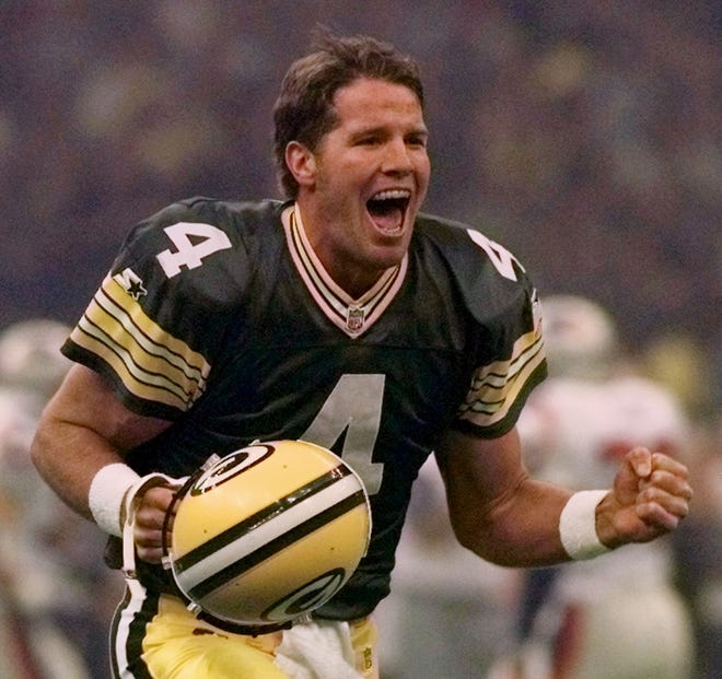 FILE - In this Jan. 26, 1997, file photo, Green Bay Packers quarterback Brett Favre celebrates after throwing a touchdown pass to Andre Rison during the Super Bowl in New Orleans. Favre was equal parts desperado and virtuoso during his 20-year NFL career that was predicated on taking big risks in the game's biggest moments. Favre will be inducted into the Pro Football Hall of Fame on Saturday, Aug. 6, 2016, in Canton, Ohio. (AP Photo/Doug Mills, File)