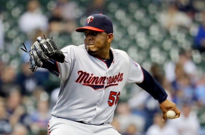 In this April 21, 2016, file photo, Minnesota Twins relief pitcher Fernando Abad throws during the seventh inning of a baseball game against the Milwaukee Brewers, in Milwaukee. The Boston Red Sox have acquired left-handed reliever Fernando Abad from the Minnesota Twins for minor league pitcher Pat Light. The deal was the first announced Monday, Aug. 1, 2016.
