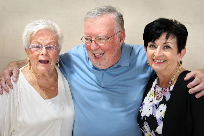 A retirement gathering was held for Joe Lyons, 77, a driver of the Quincy elder services medical rides van for 17 years, at the Kennedy Senior Center, in Quincy, Friday, July 22, 2016. Carol Lydon, a dispatcher and Michele Paige, a driver and dispatcher flank Lyons.