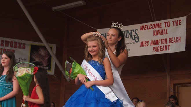 Ashley Alukonis of Lynn, Massachusetts, being crowned Little Miss Hampton Beach Saturday at the Seashell Stage. Photo by Max Sullivan/Seacoastonline