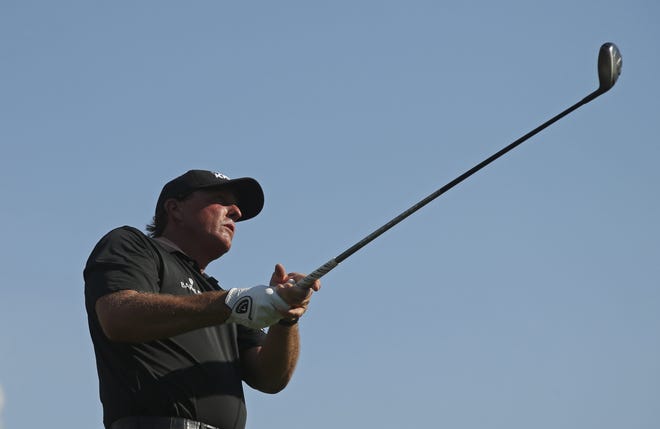 Phil Mickelson watches his tee shot on the 11th hole during the second round of the PGA Championship golf tournament at Baltusrol Golf Club in Springfield, N.J., on Friday. Associated Press/Seth Wenig