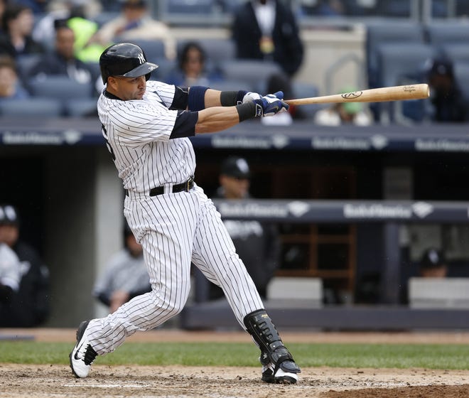 New York Yankees' Carlos Beltran hits a two-run home run off the Chicago White Sox' Zach Duke in the sixth inning of a baseball game in New York in May. The Yankees traded Beltran to the AL West-leading Texas Rangers for right-hander Dillon Tate, the fourth overall pick in the 2015 amateur draft, and two other pitching prospects. Associated Press file