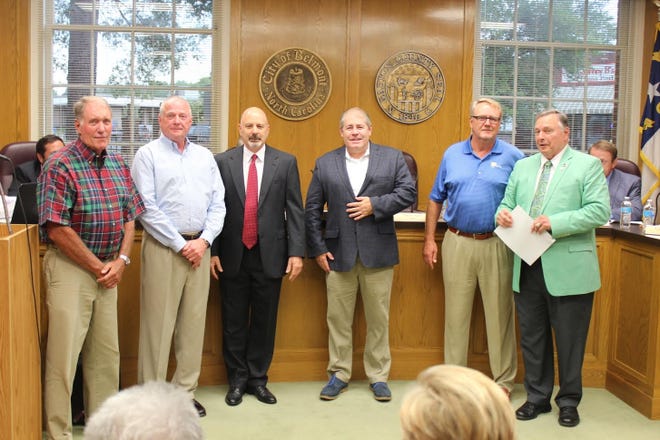 From left to right: Belmont ABC Board members Joe Stowe, Charles Olsen, Tony Marder, Jonathan Taylor, Mike Pate and Belmont Mayor Charlie Martin at a city council meeting Monday night. The five members were sworn in and will oversee the city's first liquor store.

Courtesy of city of Belmont.