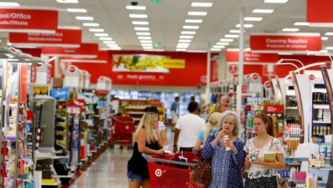 Shoppers walk around back to school supplies at the Target store on Palm Beach Lakes Boulevard in West Palm Beach. (Richard Graulich / The Palm Beach Post)
