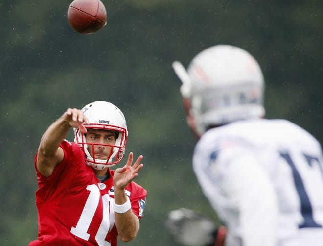 Aaron Dobson (17) hauls in a pass from Jimmy Garoppolo during Patriots training camp practice on Friday.