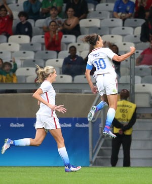 Carli Lloyd (right) celebrates after scoring against New Zealand during an Olympic women's soccer match in Belo Horizonte, Brazil, Wednesday.