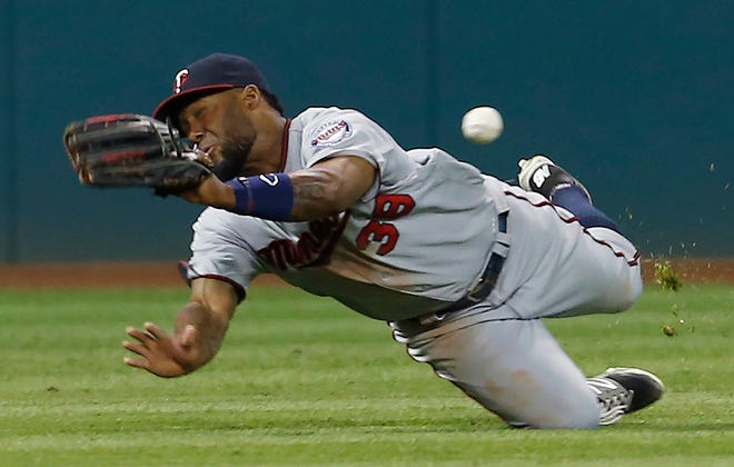 Minnesota Twins' Danny Santana makes a diving attempt on a double by Cleveland Indians' Jose Ramirez during the sixth inning of a baseball game Wednesday, Aug. 3, 2016, in Cleveland. (AP Photo/Ron Schwane)