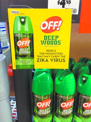 This July 15, 2015 photo shows a display for cans of Off! insect repellent with a sign which reads, "Repels the mosquitos that may carry the Zika virus" at a home improvement store in Fairless Hills, Pa. In a first for a bugspray, Off! became the official insect repellent supplier for an Olympic Games when it signed on to send 115,000 of its products to the 2016 Rio Olympics. (AP Photo/Linda A. Johnson)