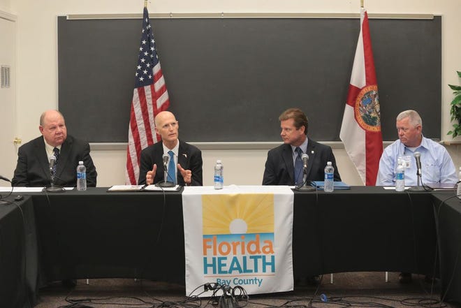 Gov. Rick Scott meets with local officials Wednesday at the Bay County Health Department for a roundtable discussion about efforts being made to combat the spread of Zika.
