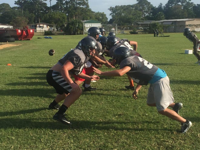 The Atlantic offensive and defensive linemen go to work in a live drill during Wednesday's practice. News-Journal/ADAM ORFINGER