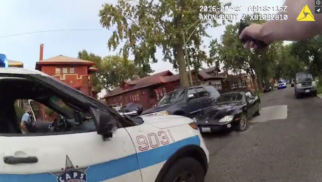 In this frame grab from a body cam provided by the Independent Police Review Authority, a Chicago police officer fires into a stolen car driven by Paul O'Neal on July 28, 2016, in Chicago. O'Neal's autopsy results showed he died of a gunshot wound to the back. (AP)