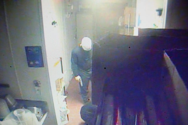 Surveillance photo of a man robbing the Sonic on South Church Street in Burlington early Friday.