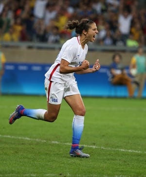 United States's Carli Lloyd celebrates her goal during a group G match of the women's Olympic football tournament between United States and France at the Mineirao stadium in Belo Horizonte, Brazil, Saturday, Aug. 6, 2016. (AP Photo/Eugenio Savio)
