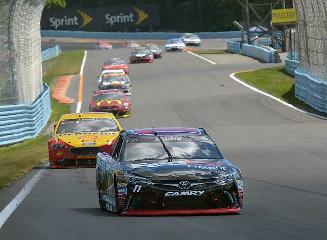 Denny Hamlin leads a pack down the backstretch on his way to winning the Cheez-It 355 at the Glen Sunday at Watkins Glen International. Eric Wensel/The Leader